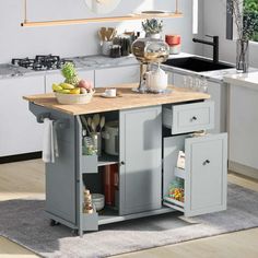 a small kitchen island with an open shelf