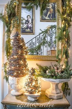 a christmas tree sitting on top of a table next to a mirror