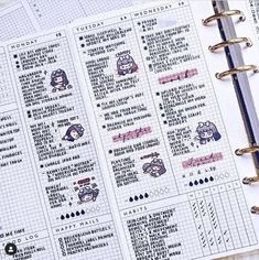 an open planner with stickers on it and a pen in front of the pages