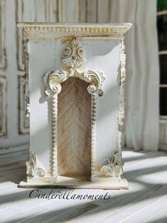 a white vase with an ornate design on it