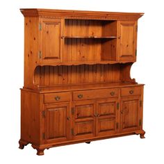 an old fashioned wooden hutch with drawers and cupboards on the front, isolated against a white background