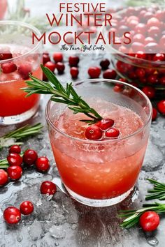 two glasses filled with cranberry punch and garnished with rosemary