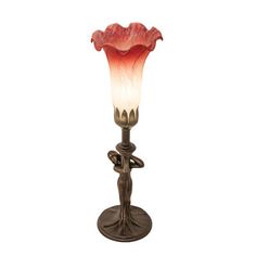 a lamp that is on top of a stand with a flower in the middle of it