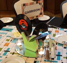 the table is set up with music themed place settings