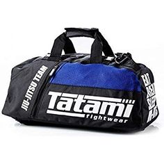 a blue and black gym bag with the tag on it's front pocket, sitting against a white background