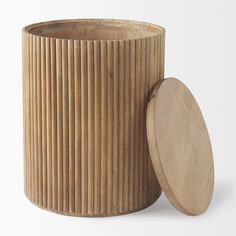 a wooden container with a lid sitting next to it