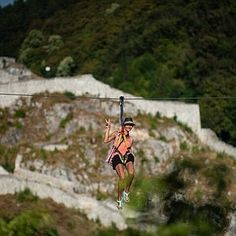 a man is zipping through the air on a rope