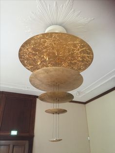 a chandelier hanging from the ceiling in a room