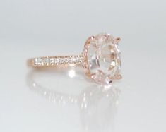 an oval cut diamond ring with side stones