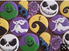 decorated cookies are arranged in the shape of jack - o - lantern and ghost faces