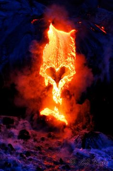 the lava is glowing orange and red as it moves through the air with its mouth open