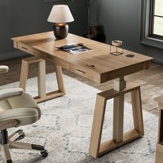 an office desk with two chairs and a lamp