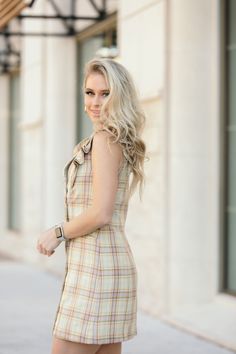 The retro-inspired Renee dress has a flattering fit with a double-breasted silhouette, side pockets and a notched lapel collar. The ruffled sleeves add to the charm of this mini plaid dress making it perfect for both Easter and Spring. Fitted Plaid Dress With Buttons For Fall, Fitted Plaid Dress With Buttons For Work, Fitted Plaid Dress For Work, Plaid Office Dress, Elegant Mini Length Plaid Dress, Chic Fitted Plaid Dress For Day Out, Plaid Button Dress For Day Out, Plaid Dresses For Work, Plaid Button Dresses For Day Out