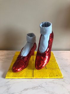 The Wizard of Oz Ruby Slipper Replicas SHOES ONLY! DISPLAY STAND AND SOCKS ARE NOT INCLUDED! These are a pair of handmade Ruby Slipper replicas from the film The Wizard Of Oz! These replicas were carefully crafted to match the original Ruby Slippers worn by Judy Garland! These shoes include painted red soles, custom bows with hand-sewn rhinestones and bugle beads, and the Innes shoe company logo on the inside sole! These shoes can be made in sizes 5 or 6 to be even more accurate to the original Ruby Slippers Wizard Of Oz, Aztec Clothing, Wizard Of Oz Movie, Wizard Of Oz Dorothy, Ruby Slipper, Wicked Costumes, Wizard Of Oz 1939, Ruby Red Slippers, Witch Shoes