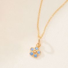 The Flower Mini Charm, featuring a delicate forget-me-not design, symbolizes the blossoming love and cherished bond between mother and child. Just as flowers grow with care, this charm represents the nurturing role of a mother and the joy of watching her child thrive. Wear it alone or pair it with your favorite Tiny Tags necklace for a meaningful, personalized touch. available in gold vermeil and sterling silver flower mini charm measures 10mm (including bail) stones are CZs and 2mm charm only Tiny Tags Necklace, Mini Charm Necklace, Tiny Tags, Mini Charm, Sterling Silver Flowers, Necklace Size, Forget Me Not, Flower Jewellery, Necklace Sizes