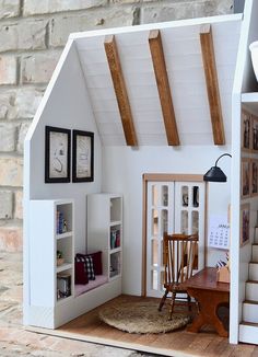 a doll house with furniture and decor on the floor