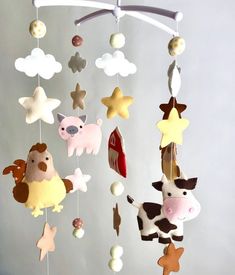 a mobile with animals and stars hanging from it