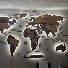 a world map is mounted on the wall