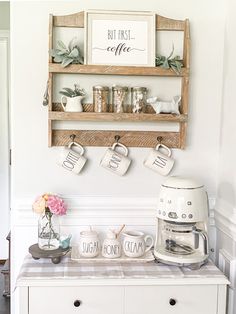 a kitchen counter with coffee mugs on it