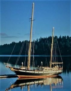 a sailboat floating on top of a body of water