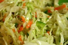 a close up view of some coleslaw and carrots