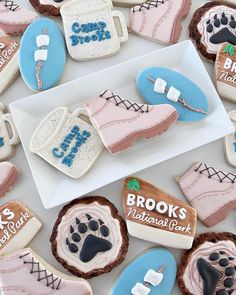 cookies decorated like shoes and boots with the names brooks national park on them