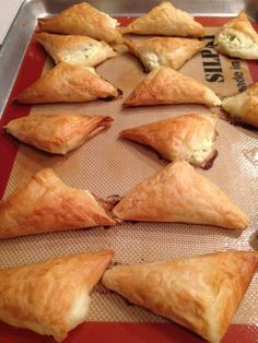 there are many pastries on the tray ready to be eaten