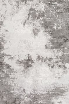 a gray and white rug with an abstract design