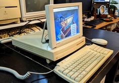 an old computer sitting on top of a desk