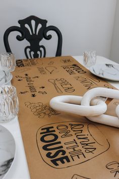 a close up of a table with plates and napkins on it, including a pair of scissors