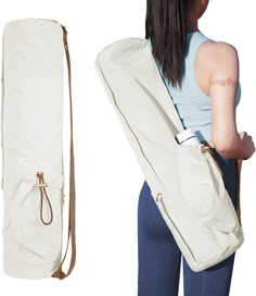 a woman carrying a large white bag on her back with the strap down to it's shoulder