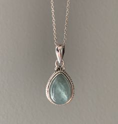 Sterling silver aquamarine necklace. Beautiful Aquamarine stones set in sterling silver. All stones are natural and therefore each one is unique. Aquamarine is a healing stone, a stone of courage used for reducing stress and calming the mind. Promotes self expression and increases sensitivity and highly protective during pregnancy. Boosts the immune system and a great meditation stone. Birthstone of March. Matching earrings available. Gift box available for purchase. Search GIFTBOX Silver Aquamarine Necklace, Aquamarine Necklace Vintage, Etsy Necklaces Unique, Silver Boho Earrings, Healing Sterling Silver Necklaces With Stones, Silver Teardrop Gemstone Birthstone Necklace, Silver Birthstone Teardrop Pendant Crystal Necklace, Silver Teardrop Crystal Necklace With Natural Stones, Silver Drop Necklace With Spiritual Style