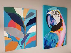 two colorful paintings hang on the wall next to each other