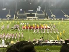 a marching band is performing on the field