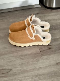 #sorelboots Casual Suede Slippers For Winter, Casual Suede Winter Slippers, Winter Suede Clogs With Rubber Sole, Winter Suede Clogs, Winter Suede Mules With Rubber Sole, Cozy Winter Slip-on Clogs, Winter Comfortable Clogs With Suede Lining, Winter Clogs With Suede Lining, Comfortable Winter Mules With Suede Lining