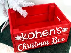 a red wooden box with the words kohen's christmas box written on it