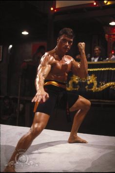 a man standing on top of a wrestling ring