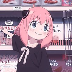 a girl with pink hair standing in front of a shelf filled with donuts and candy