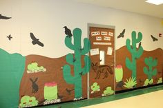 this is an image of a classroom door decorated with cactus and birds in the desert