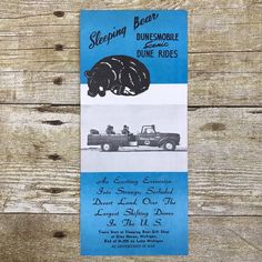 a blue and white ticket for sleeping bear drive rides