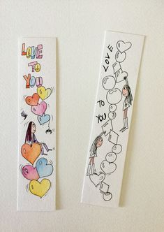 two children's bookmarks with the words love to you written on each one