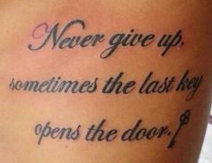 a tattoo saying never give up, sometimes the last key opens the door