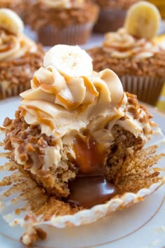 cupcakes with banana slices and caramel drizzled on the top