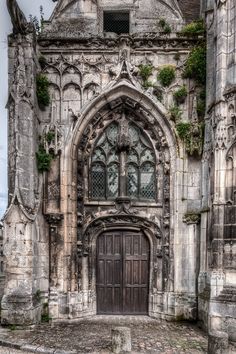 an old building with a large wooden door