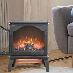 a living room with a chair and a fire place in the corner on the floor