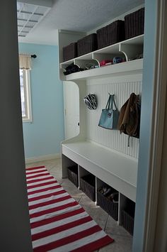 the entryway is clean and ready to be used as a storage area for shoes