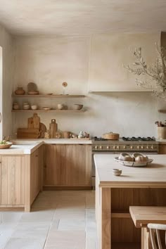 a kitchen filled with lots of wooden furniture