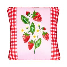 a red and white checkered pillow with strawberries on it