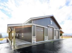 a large garage sitting on the side of a road