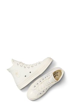 A 1970s icon lives on in an always-cool canvas sneaker that still sports the streamlined profile and glossy rubber cupsole inspired by the timeless original. Lace-up style Removable OrthoLite® insole Textile upper and lining/rubber sole Imported Gender Inclusive, Converse White, White Converse, High Top Sneaker, Canvas Sneakers, Chuck Taylor All Star, Chuck Taylor, Up Styles, Chuck Taylors